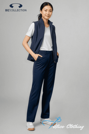 Full-body portrait of a woman in a navy sleeveless vest over a white T-shirt with matching navy trousers and white sneakers, standing against a gray studio background; Biz Collection and Alice Clothing logos visible.