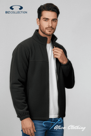Male model wearing a black zip-up jacket over a white tee, against a light gray background.