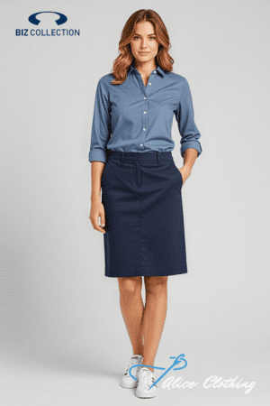 Female model wearing a light blue button-down shirt and navy knee-length skirt, standing with one hand in her pocket; Biz Collection and Alice Clothing logos visible.