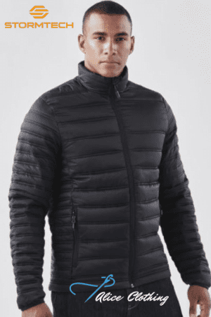 Man modeling a black quilted puffer jacket with a front zipper and zip pockets; Stormtech logo in the top-left corner and an Alice Clothing watermark at the bottom.