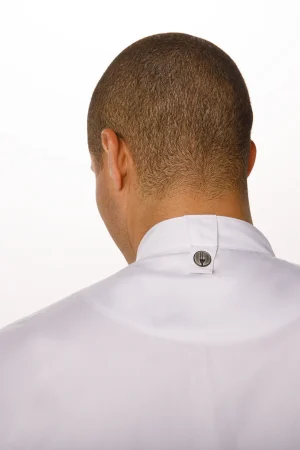 Back view of a person wearing a white shirt with a small metal logo button at the collar on the back of the neck.