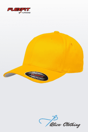 Yellow Flexfit baseball cap on a light gradient background; top-left Flexfit logo and bottom Alice Clothing watermark.