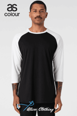 Male model wearing a black raglan shirt with white three-quarter sleeves, standing against a light background; 'as colour' logo top-left.