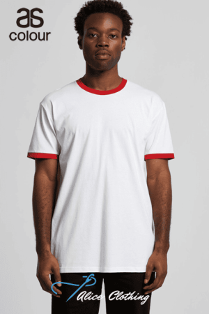 Man modeling a plain white T-shirt with red neckline and sleeve cuffs, standing against a light gray background with brand logos nearby.