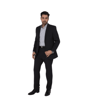 Man in a dark suit and light shirt stands facing the camera with a confident pose.
