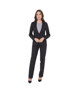 Professional woman in a dark blazer and matching pants, standing with hands clasped in front of her.