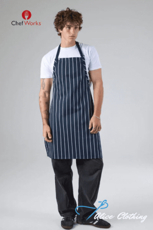 Male model wearing a navy pinstripe kitchen apron over a white T-shirt, standing against a gray backdrop; logos for ChefWorks and Alice Clothing visible.