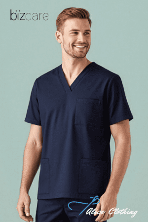 Male model wearing navy V-neck scrubs with chest and pocket pants, smiling against a light teal background; Bizcare logo top-left and Ace Clothing watermark bottom-right.