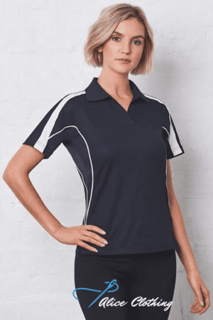 Woman modeling a navy polo shirt with white piping, standing with one hand on her hip; Alice Clothing logo visible at the bottom.
