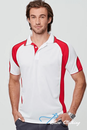 Male model wearing a white polo shirt with red panels, standing with hands in pockets.