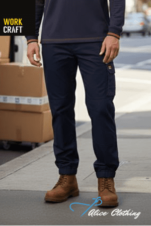 Person wearing navy cargo pants and brown lace-up boots on a city sidewalk; logos for Work Craft and Alice Clothing appear.