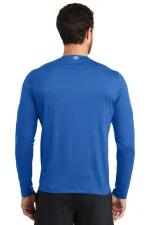 Back view of a man wearing a blue long-sleeve athletic shirt with a small logo at the upper back near the neck.