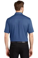 Back view of a man wearing a blue short-sleeve polo shirt, tucked into black trousers with a black belt