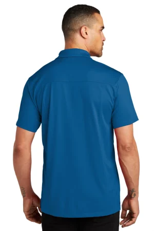 Back view of a man wearing a bright blue short-sleeve shirt, standing against a white background.