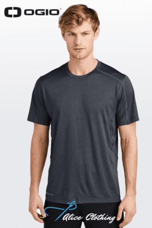 Male model wearing a dark gray short-sleeve athletic T-shirt, standing against a light gradient background; OGIO logo top left.