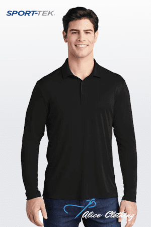 Smiling man in a black long-sleeve polo shirt standing against a light gradient background; SPORT-TEK logo top left.