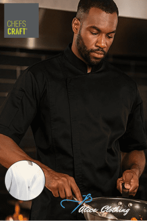 CJ054 Light Weight Zip Short Sleeve Chefs Jacket With Micro Mesh Panels - Alice Clothing Male chef in a black chef coat cooks at a stove in a professional kitchen; Chefs Craft logo appears in the top-left corner.
