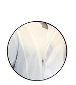 Close-up of a white zip-up jacket zipper on a circular cropped frame.