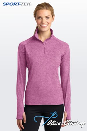 LST850 Ladies Sport-Wick Stretch 12-Zip Pullover - Alice Clothing Model wearing a pink heathered quarter-zip athletic pullover; 'Sport-Tek' logo visible in the top left against a light gradient background.