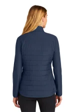 Back view of a woman wearing a navy quilted jacket with horizontal stitching and long sleeves