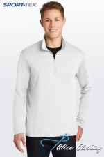 Male model wearing a light gray quarter-zip pullover against a pale backdrop with SPORT-TEK branding in the corner.