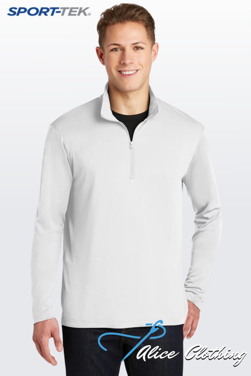 Male model wearing a light gray quarter-zip pullover against a pale backdrop with SPORT-TEK branding in the corner.