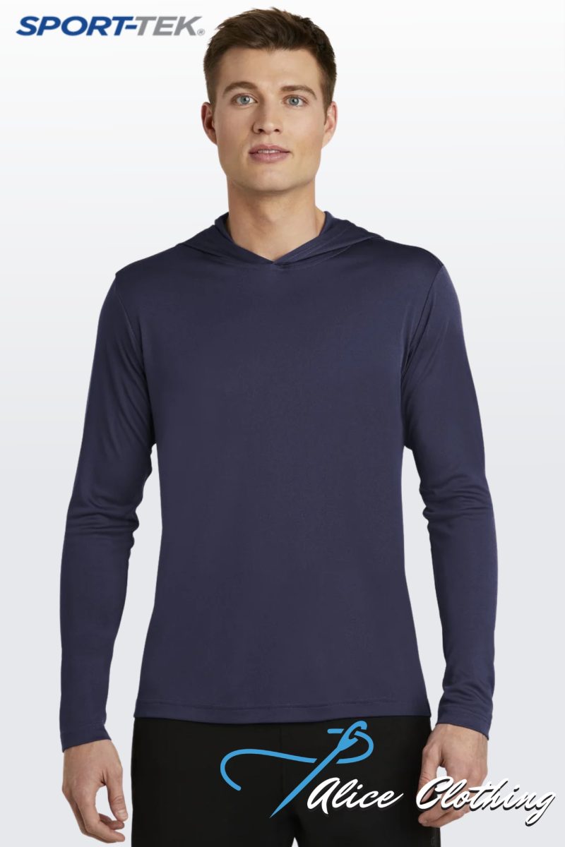 Man wearing a navy long-sleeve athletic shirt, standing against a light gradient background; SPORT-TEK logo in the top-left corner.