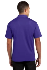 Back view of a man wearing a royal purple polo shirt with short sleeves, standing with arms at his sides.