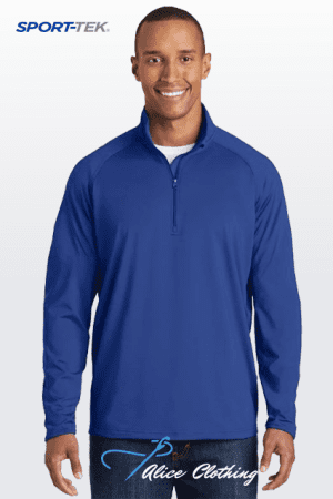 Smiling man wearing a royal-blue long-sleeve quarter-zip athletic top; SPORT-TEK logo at top left and Nice Clothing branding at bottom.